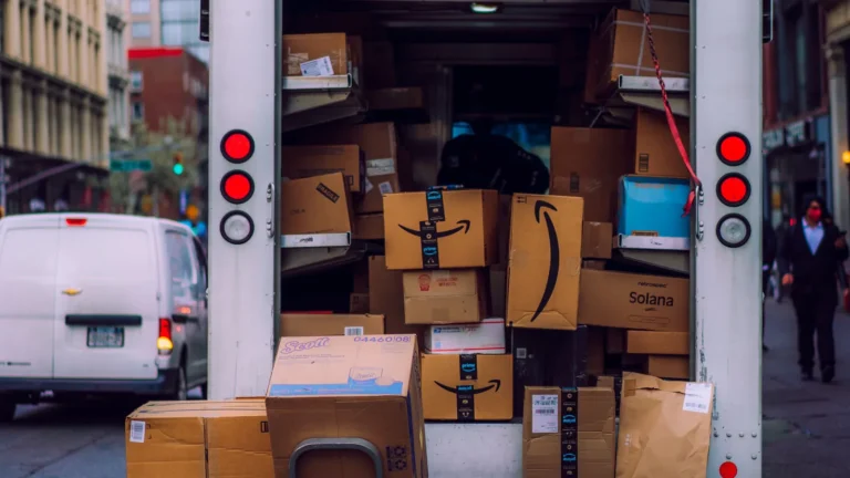 Delivery truck packed with Amazon and other parcels on a city street